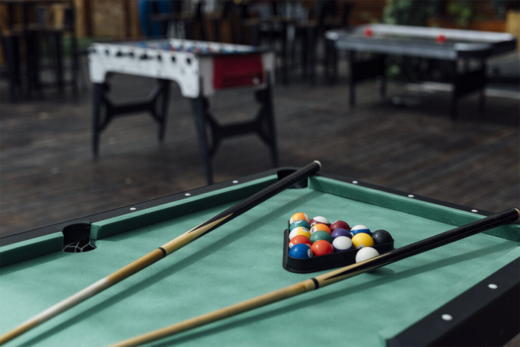 billiard ball table in dramatic light.