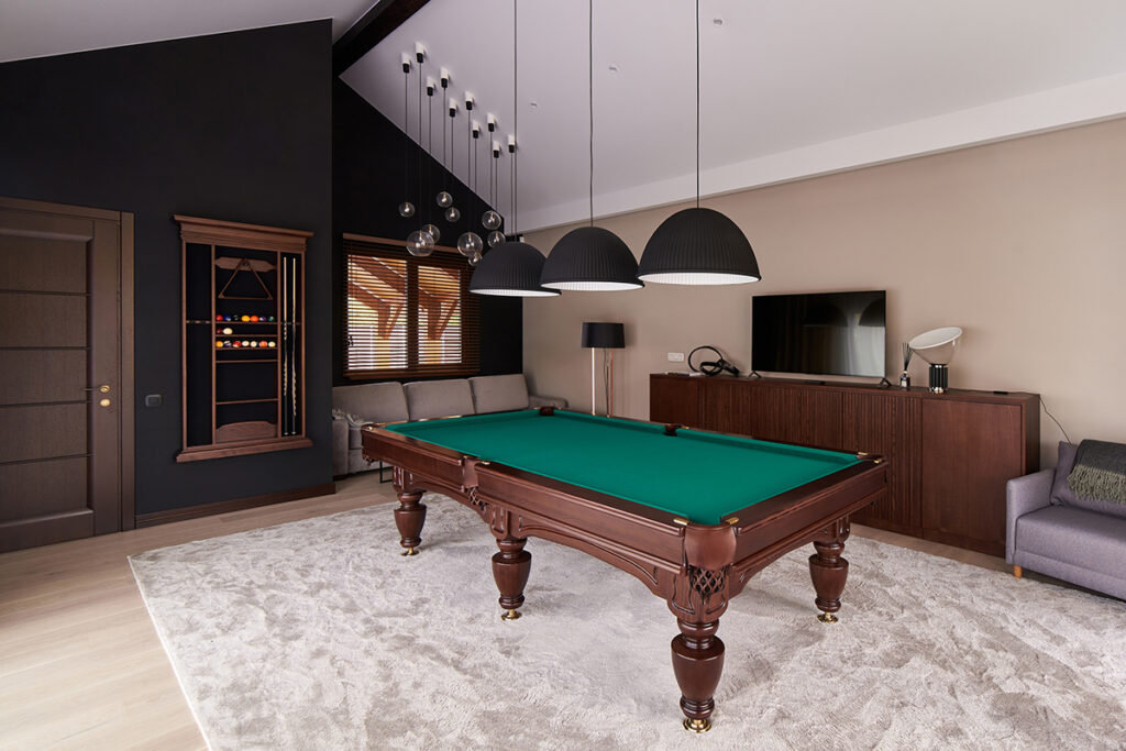 modern billiard room with a beautiful table and large windows