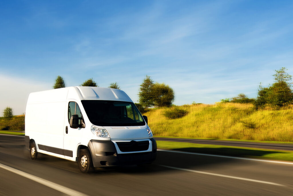 White delivery van on the road
